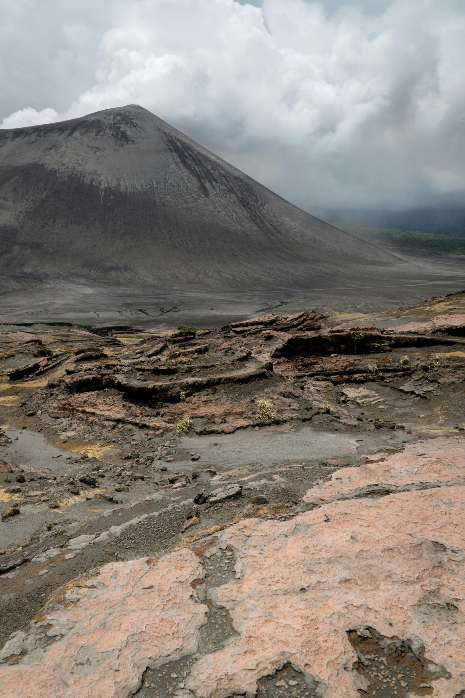 brown and gray mountain under white clouds during daytime