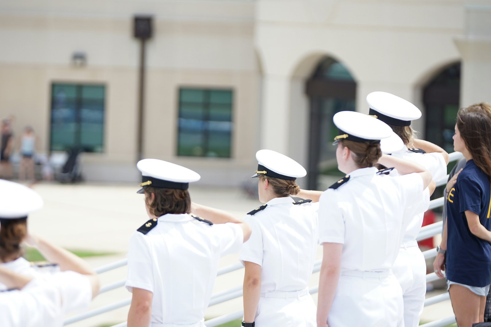 five person wearing white suits