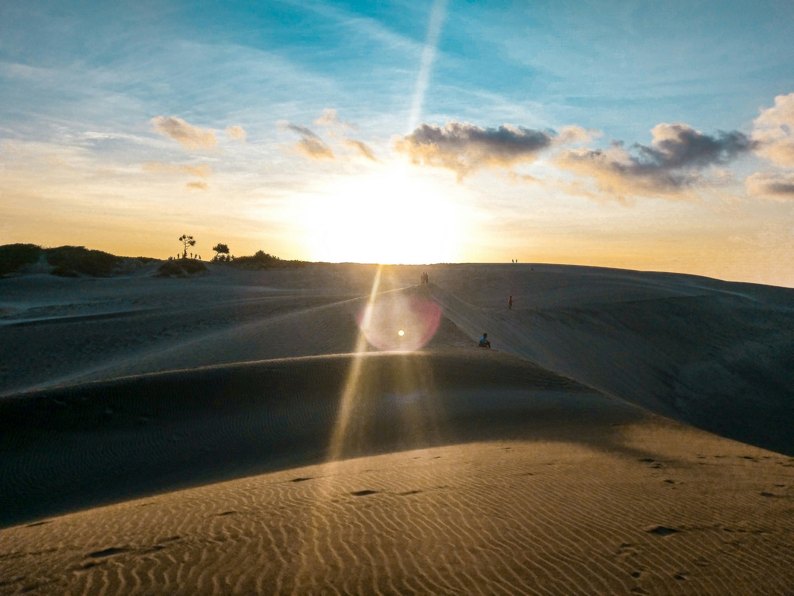 person walking on sand during daytime national anthem